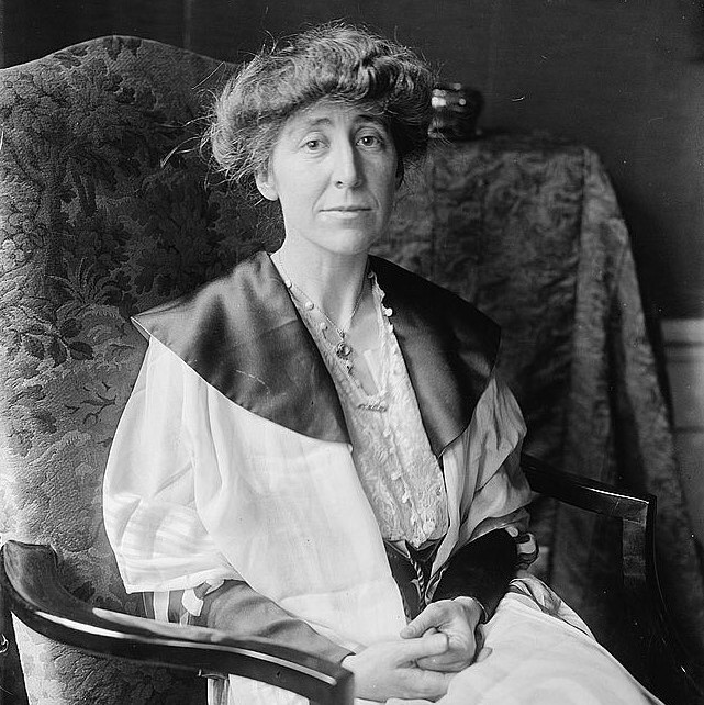 Black and white seated portrait of Jeannette Rankin