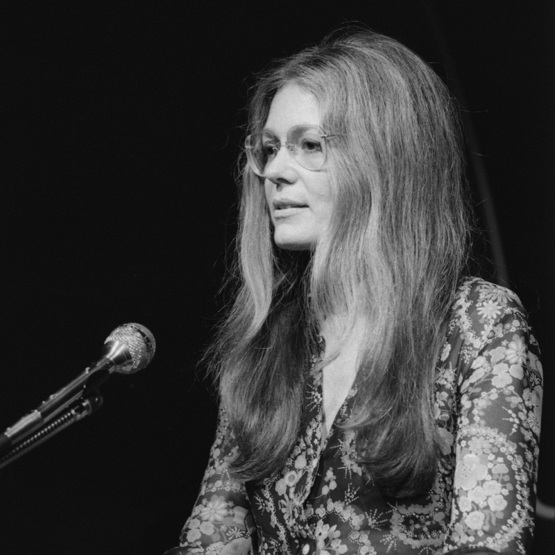 Black and white photo of Gloria Steinem giving a speech